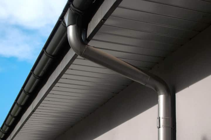 Corrosion-resistant galvanized gutters installed on a commercial building in San Antonio